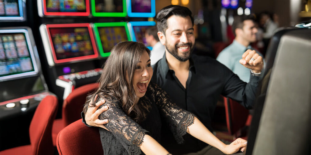 A couple playing a game at a casino.