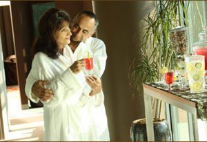Man and women in robes embracing eachother